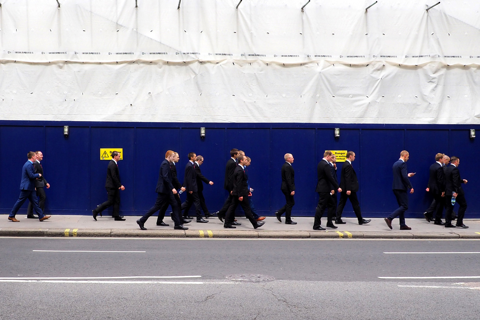 A group of men in business suits walking together